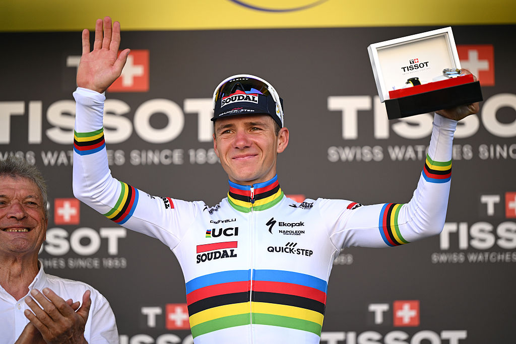CAEN, FRANCE - JULY 09: Remco Evenepoel of Belgium and Team Soudal Quick-Step celebrates at podium as Tissot ITT special prize winner with the presence of the two times Tour de France winner Bernard Thevenet of France (L) during the 112th Tour de France, Stage 5 a 33km individual time trial stage from Caen to Caen / #UCIWT / on July 09, 2025 in Caen, France. (Photo by Dario Belingheri/Getty Images)